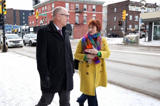 Winnipeg Mayor Scott Gillingham chats with Osborne Village Biz Executive Director Zohreh Gervais as they walk along Osborne Street. (Ruth Bonneville / Free Press)