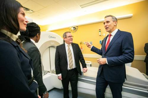 MIKAELA MACKENZIE / FREE PRESS Neurosurgeon Dr. Anthony Kaufmann (right, beside HSC Foundation CEO Jonathon Lyon) says the new gamma knife technology will benefit HSC patients in general, not only just those in neurosurgery.