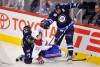 Fred Greenslade / REUTERS FILES
                                Former Winnipeg Jets fan favourite, Dustin Byfuglien, standing, has agreed to suit up for an alumni game that will be held prior to the Heritage Classic next fall between the Winnipeg Jets and the Montreal Canadiens.