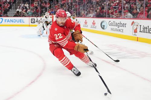 RYAN SUN / THE ASSOCIATED PRESS
                                Detroit Red Wings centre Mason Appleton (22) moves the puck against Chicago Blackhawks defenceman Artyom Levshunov, behind, during the second period of an NHL hockey game in November in Detroit.