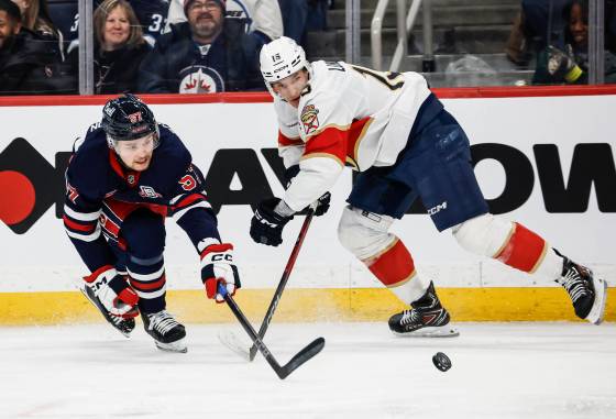 Winnipeg Jets defenceman Elias Salomonsson (left) continues to impress in his development, playing in just his 10th NHL game Thursday night against Tampa Bay. (John Woods / The Canadian Press files)