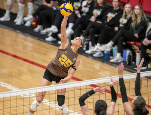 BROOK JONES/FREE PRESS
                                University of Manitoba Bisons left side Raya Surinx spikes the ball during first set action against the Wesmen.