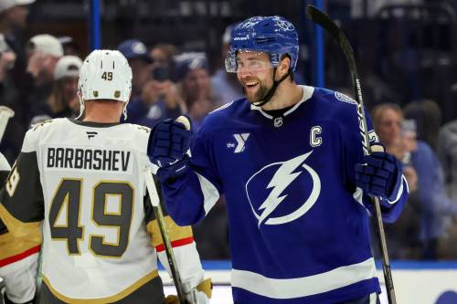 (AP Photo/Mike Carlson)
                                Tampa Bay Lightning&rsquo;s Victor Hedman, right, celebrates an overtime win against the Vegas Golden Knights in an NHL hockey game Sunday, Oct. 26, 2025, in Tampa, Fla.