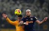 Wolverhampton Wanderers' Joao Gomes, left, and Newcastle United's Joelinton battle for the ball during the English Premier League soccer match between Wolves and Newcastle United in Wolverhampton, England, Sunday Jan. 18, 2026. (Martin Rickett/PA via AP)
