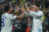 Aston Villa's Jadon Sancho, right, celebrates with teammate Youri Tielemans after scoring the opening goal during a Europa League opening phase soccer match between Fenerbahce and Aston Villa, in Istanbul, Turkey, Thursday, Jan. 22, 2026. (AP Photo/Francisco Seco)