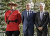 Governor of the Bank of Canada Tiff Macklem, centre, and United States chair of the Federal Reserve Jerome Powell pose for photos with an RCMP officer prior to the G7 Finance Ministers meeting in Banff, Alta., Wednesday, May 21, 2025. THE CANADIAN PRESS/Jeff McIntosh