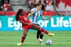 Canada's Nichelle Prince (15) and Argentina's Aldana Cometti (6) vie for the ball during the second half of an international friendly soccer match in Vancouver, on Friday, April 4, 2025. THE CANADIAN PRESS/Ethan Cairns