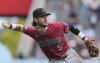 FILE - Arizona Diamondbacks third baseman Blaze Alexander throws during a baseball game in San Francisco, Sept. 10, 2025. (AP Photo/Jeff Chiu, File)
