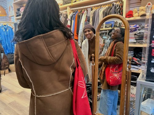 Owner Kadjahtou Balde, center, interacts with Tyllah Gorham, at Modify Thrift in Harlem, in the Manhattan borough of New York, Friday, Jan. 23, 2026. (Ulaa Kuziez/RNS via AP)