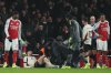 Trainers check on Liverpool's Conor Bradley during the English Premier League soccer match between Arsenal and Liverpool in London, Thursday, Jan. 8, 2026. (AP Photo/Ian Walton)