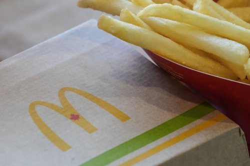 A maple leaf is seen on a McDonald's logo on food packaging at a McDonald's Restaurant in Brampton, Ont., Wednesday, March 12, 2025. THE CANADIAN PRESS/Chris Young