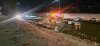 Firefighters stage at the side of a flooded highway in this handout photo, as the broken Bearspaw South Feeder Main, centre, spews water in Calgary, on Tuesday, Dec. 30, 2025. THE CANADIAN PRESS/Handout - Ian Royer (Mandatory Credit)