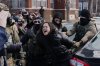 CORRECTS FROM A PROTESTER TO A PERSON - A person is detained by federal agents near the scene where Renee Good was fatally shot by an ICE officer last week, Tuesday, Jan. 13, 2026, in Minneapolis. (AP Photo/Adam Gray)