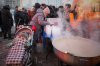 Yuliia Dolotova, 37, receives hot food at a distribution point during a power outage caused by Russia’s repeated air strikes on the country’s power grid, in Kyiv, Ukraine, Monday, Feb. 2, 2026. (AP Photo/Sergey Grits)