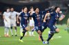 PSG's Goncalo Ramos, Senny Mayulu and Marquinhos, from right, celebrate after a penalty shootout to win the French Super Cup soccer match between PSG and Marseille in Kuwait City, Kuwait, Thursday, Jan. 8, 2026. (AP Photo/Jaber Abdulkhaleg)