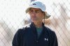 FILE - San Diego Padres general manager A.J. Preller watches a bullpen session during spring training baseball practice at the team's training facility Saturday, Feb. 15, 2025, in Peoria, Ariz. (AP Photo/Lindsey Wasson, File)