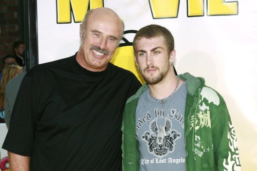 FILE - Dr. Phil McGraw, left, and his son, Jordan McGraw, arrive at the premiere of 'The Simpsons Movie' in Los Angeles, July 24, 2007. (AP Photo/Matt Sayles, File)