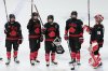 Team Canada's Marie-Philip Poulin, centre, holds the Rivalry Series trophy while celebrating with teammates following Canada's 3-1 victory over Team USA in Summerside, P.E.I. on Saturday, Feb. 8, 2025. THE CANADIAN PRESS/Darren Calabrese