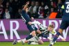 Newcastle's Lewis Hall is challenged by PSG's Joao Neves, left, during a Champions League opening phase soccer match between Paris Saint-Germain and Newcastle in Wednesday, Jan. 28, 2026. (AP Photo/Michel Euler)