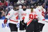 Canada forward Marie-Philip Poulin, left, celebrates with defensewoman Renata Fast, second from left, forward Daryl Watts (95) and forward Julia Gosling after scoring during the second period of a Rivalry Series women's hockey game against the United States, Saturday, Nov. 8, 2025, in Buffalo, N.Y. (AP Photo/Adrian Kraus)
