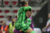 Canada goalkeeper Kailen Sheridan, top, celebrates with goalkeeper Sabrina D'Angelo after Vanessa Gilles scored her side's opening goal during a women's Group A soccer match between Colombia and Canada, at the 2024 Summer Olympics, Wednesday, July 31, 2024, at the Nice Stadium in Nice, France. (AP Photo/Julio Cortez)