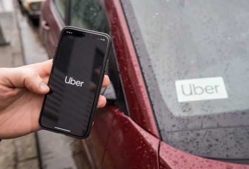 The Uber app is seen on an iPhone near a driver's vehicle in Vancouver, Friday, Jan. 24, 2020. THE CANADIAN PRESS/Darryl Dyck