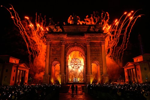 Italian former skier Deborah Compagnoni and Italian former skier Alberto Tomba light the cauldron at the Arco della Pace during the Olympic opening ceremony at the 2026 Winter Olympics, in Milan, Italy, Friday, Feb. 6, 2026. (AP Photo/Bernat Armangue)