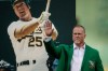 FILE - Former Oakland Athletics Mark McGwire waves to fans after being inducted into the A's Hall of Fame prior to the baseball game against the Texas Rangers, Sept. 21, 2019, in Oakland, Calif. (AP Photo/Ben Margot, File)