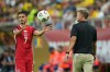 Canada's Stephen Eustáquio throws the ball next to Canada's coach Jesse Marsch during an international friendly soccer match between Romania and Canada at the National Arena stadium in Bucharest, Romania, Friday, Sept. 5, 2025. (AP Photo/Andreea Alexandru)