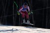 Canada's James Crawford speeds down the course during an alpine ski, men's downhill race, at the 2026 Winter Olympics, in Bormio, Italy, Saturday, Feb. 7, 2026. (AP Photo/John Locher)