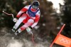 Switzerland's Franjo von Allmen speeds down the course during an alpine ski, men's downhill race, at the 2026 Winter Olympics, in Bormio, Italy, Saturday, Feb. 7, 2026. (AP Photo/Gabriele Facciotti)