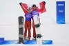 Canada's Meryeta O'Dine and Eliot Grondin celebrate their bronze medal in mixed team snowboard cross at the 2022 Beijing Winter Olympics in Zhangjiakou, China on Saturday, Feb. 12, 2022. THE CANADIAN PRESS/Sean Kilpatrick