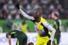 Dortmund's Serhou Guirassy celebrates after scoring their side's second goal of the game during the German Bundesliga soccer match between Wolfsburg and Borussia Dortmund, in Wolfsburg, Germany, Saturday, Feb. 7, 2026. (David Inderlied/dpa via AP)