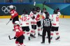 Canada’s Claire Thompson (42), Erin Ambrose (23), Julia Gosling (88), Sophie Jaques (2) and  Brianne Jenner (19) celebrate Canada’s Brianne Jenner's goal against Switzerland during the third period of a preliminary round women's hockey game at the Milan Cortina Winter Olympics, in Milan, on Saturday, Feb. 7, 2026. THE CANADIAN PRESS/Darryl Dyck