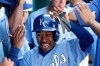 FILE - Kansas City Royals' Terrance Gore (0) celebrates in the dugout after scoring on a double by Alex Gordon during the seventh inning of a baseball game against the Detroit Tigers, Sunday, Sept. 21, 2014, in Kansas City, Mo. (AP Photo/Charlie Riedel, File)