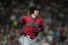 FILE - Arizona Diamondbacks' Jake McCarthy watches his home run during the third inning of a baseball game against the San Diego Padres Friday, Sept. 26, 2025, in San Diego. (AP Photo/Gregory Bull, File)