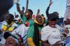 Fans celebrate Senegal's goal as they watch a live broadcast of the Africa Cup of Nations semifinal soccer match between Senegal and Egypt in Dakar, Senegal, Wednesday, Jan. 14, 2026. (AP Photo/Misper Apawu)