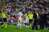 Real Madrid's Vinicius Junior, third from right, receives a yellow card during the Spanish Super Cup semifinal soccer match against Atletico Madrid at King Abdullah Sports City Stadium in Jeddah, Saudi Arabia, Thursday, Jan. 8, 2026. (AP Photo/Altaf Qadri)