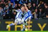 Real Sociedad's Goncalo Guedes, right, celebrates with Real Sociedad's Alvaro Odriozola after scoring his side's second goal during the Spanish La Liga soccer match between Real Sociedad and Barcelona in San Sebastian, Spain, Sunday, Jan. 18, 2026. (AP Photo/Miguel Oses)