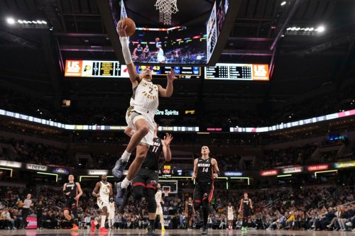 Indiana Pacers guard Andrew Nembhard (2) shoots in front of Miami Heat forward Jaime Jaquez Jr. (11) during the first half of an NBA basketball game in Indianapolis, Saturday, Jan. 10, 2026. (AP Photo/AJ Mast)