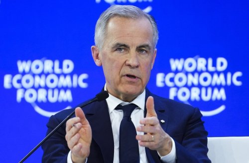 Prime Minister Mark Carney delivers a speech at the World Economic Forum in Davos, Switzerland on Tuesday, Jan. 20, 2026. THE CANADIAN PRESS/Sean Kilpatrick