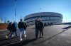 Spectators pose for a selfie outside Milano Santagiulia Ice Hockey Arena before Italy and France played a women's hockey game at the 2026 Winter Olympics in Milan on Thursday, Feb. 5, 2026. THE CANADIAN PRESS/Darryl Dyck