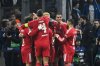 Liverpool players celebrate after Liverpool's Dominik Szoboszlai scored his side's opening goal during the Champions League opening phase soccer match between Marseille and Liverpool in Marseille, France, Wednesday, Jan. 21, 2026. (AP Photo/Philippe Magoni)