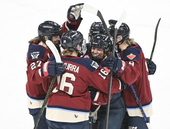 Montreal Victoire's Maureen Murphy (21) celebrates with teammates Hayley Scamurra (16) Shiann Darkangelo (27), Erin Ambrose (23) and Kati Tabin (9) after scoring against the Ottawa Charge during a Jan. 24 game. (Graham Hughes / The Canadian Press files)