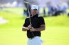 Brooks Koepka reacts after missing a birdie putt on the fourth hole on the South Course at Torrey Pines during the first round of the Farmers Insurance Open golf tournament Thursday, Jan. 29, 2026, in San Diego. (AP Photo/Denis Poroy)