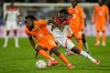 Burkina Faso's Issa Kabore, right, challenges Ivory Coast's Yan Diomande during the Africa Cup of Nations best of 16 soccer match between Ivory Coast and Burkina Faso in Marrakech, Morocco, Tuesday, Jan. 6, 2026. (AP Photo/Themba Hadebe)