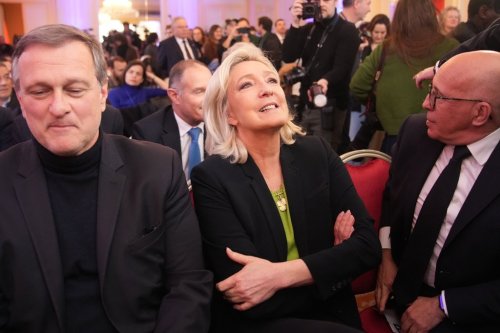 Far-right leader Marine Le Pen, center, is framed by Louis Aliot, left, and conservative lawmaker Eric Ciotti during National Rally president Jordan Bardella's New Year address to the press, Monday, Jan. 12, 2026 in Paris. (AP Photo/Christophe Ena)