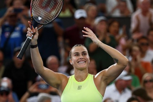 Aryna Sabalenka of Belarus waves to the crowd after winning the women's final match against Marta Kostyuk of Ukraine 6-4, 6-3, at the Brisbane International tennis tournament in Brisbane, Australia, Sunday, Jan. 11, 2026. (AP Photo/Tertius Pickard)