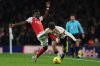 Arsenal's Bukayo Saka fouls Liverpool's Milos Kerkez during the English Premier League soccer match between Arsenal and Liverpool in London, Thursday, Jan. 8, 2026. (AP Photo/Ian Walton)