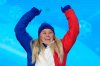 FILE - Silver medalist Tess Ledeux of France celebrates during a medal ceremony for the women's freestyle skiing big air at the 2022 Winter Olympics, on Feb. 8, 2022, in Beijing. (AP Photo/Natacha Pisarenko, File)